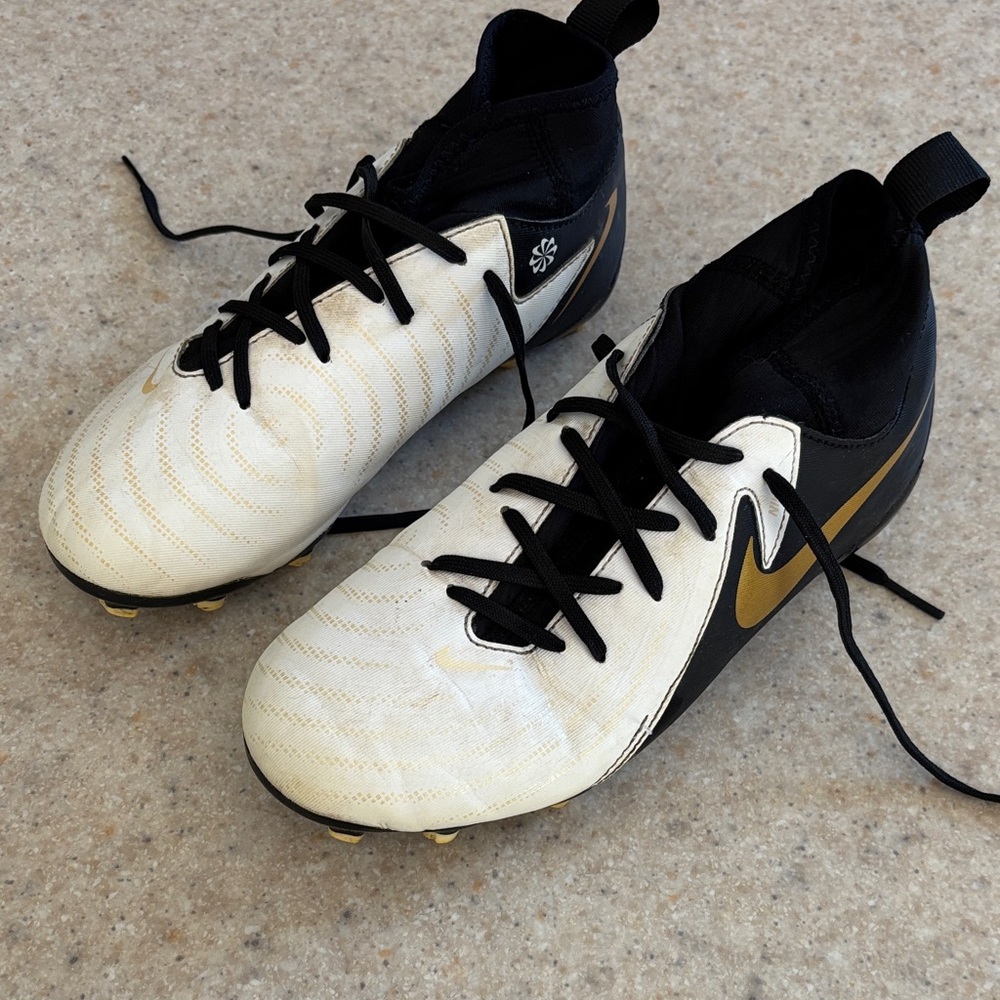 Nike Black, White, and Gold Soccer Cleats